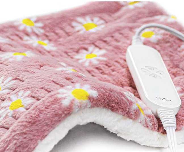 Fuzzy fabric heating pad that's pink with white flowers